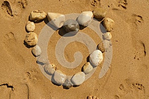 Love heart from pebbles on a beach