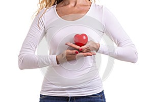 Love heart, protect and healthcare concept : Caucasian woman holding red heart on her chest and heart position isolated on white