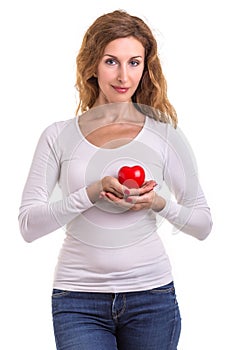 Love heart, protect and healthcare concept : Caucasian woman holding red heart on her chest and heart position isolated on white