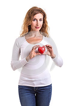 Love heart, protect and healthcare concept : Caucasian woman holding red heart on her chest and heart position isolated on white