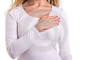 Love heart, protect and healthcare concept : Caucasian woman pressing on her chest and heart position isolated on white