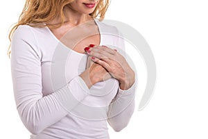 Love heart, protect and healthcare concept : Caucasian woman pressing on her chest and heart position isolated on white