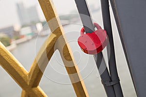 Love heart shape lock with metal chain on bridge