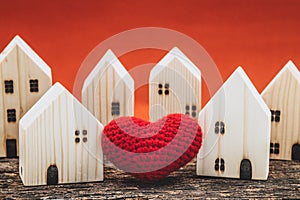 Love heart between two house wood model for stay at home love share support together with healthy good community concept
