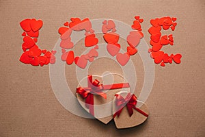Love from hearts and gift boxes in the shape of hearts. Gifts for Valentine's Day.