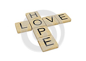 Love Hope words written with wooden letters, isolated on white background