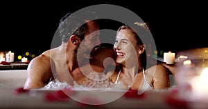 Love, hot tub and happy couple laugh, talk or bond on Valetines Day date, anniversary or funny honeymoon communication