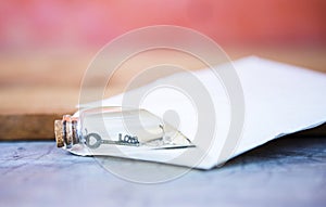 Love key and scroll in glass message bottle