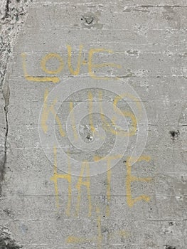 Love kills hate quote brick wall paint