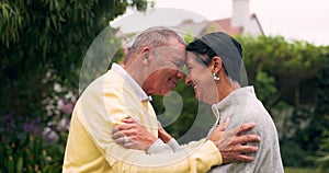 Love, kiss and hug with old couple in garden for retirement, happy and relax. Care, support and smile with senior man