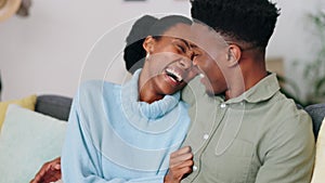 Love, laugh and african couple relaxing on a sofa in their modern home while having a conversation. Happy, young and