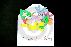 Love letter with romantic message and colourful flowers on the black background