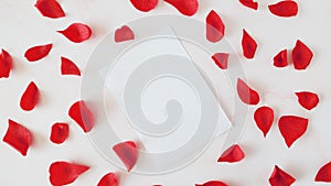 Love letter for St. Valentine's day and rose petals, copy scape for text, white background