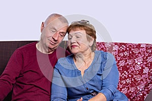 Love lives forever. Senior couple at home. Handsome old man and attractive old woman hugging and enjoying vacation together