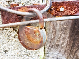 Love lock as a symbol of love and unity hanging on a bridge railing