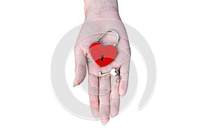 Love lock and key in the shape of a heart on a female palm isolated on a white background. Red metal lock in the form of a heart.