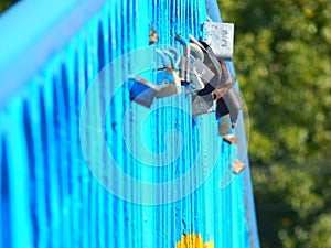 Love lock symbol attached on the bridge of eternal friendship and love, the concept of the union of spouses