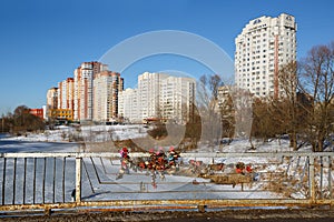Love locks on the bridge against the background of a new residential district. Balashikha, Russia.