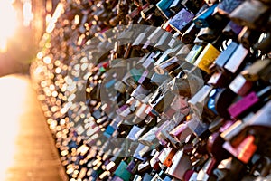 Love locks on the bridge in evening light.