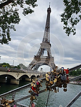 Love locks on a bridge next to Eiffel Tower