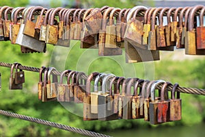 Love locks hanging on a bridge