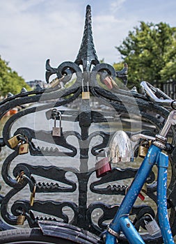 Love locks on the Magere brug (skinny bridge) over the river Amstel in Amsterdam