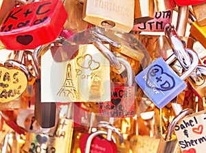 Love locks (padlocks) attached to the bridge in Paris. France.