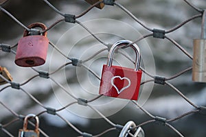 Love locks padlocks on a bridge in Graz