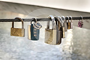 Love locks tied on a bridge as a symbol of eternal love