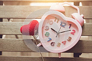 Love memory heart clock on wood background