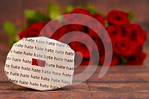 Love message with Red roses in a bunch as a background.