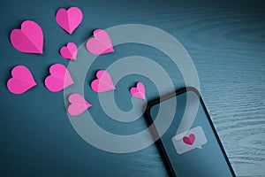 Love Message. Valentines Day Concept. Sending Heart Symbol to someone via Mobile Phone