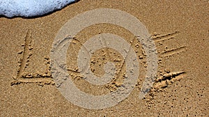 Love message written in sand