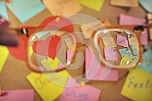 Love messages on post-its seen through retro glass