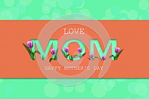 Love Mom, cutting inscription on a coral background. Beautiful tulips. Happy Mother`s Day, greeting card. Festive banner