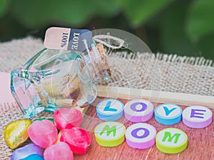 Love mom spelled with colorful alphabet blocks