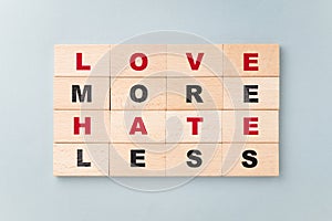 Love More Hate Less, inspiration quote by wood blocks