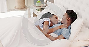 Love, morning and black couple relax in bed together, talking, speaking and having conversation. Affection, happiness