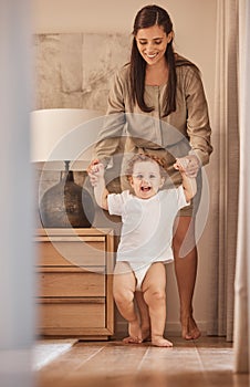 Love, mother and baby learning to walk while holding hands for support and child development. Happy, excited, and