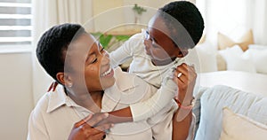 Love, mother and excited child hug playing together bonding in bedroom at house. Happy black woman and baby affection