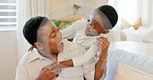 Love, mother and excited child hug playing together bonding in bedroom at house. Happy black woman and baby affection