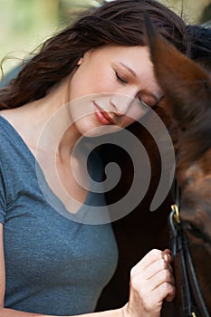 Love, nature and young woman with her horse on an outdoor farm for sports racing. Smile, happy and confident female