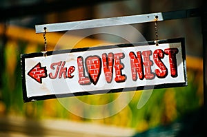 The love nest sign on the metalic board