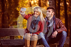 Love in the park- couple in the park taking selfie