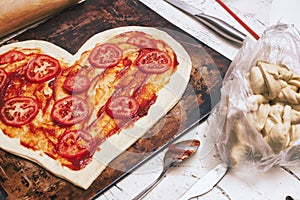 Love pizza. Baked heart-shaped homemade pizza