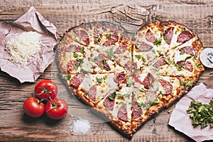 Love pizza. Baked heart-shaped homemade pizza