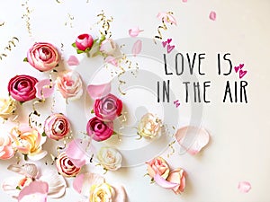 Love quotes and Happy Valentin quotes text Greetings card ,Pink roses on white greetings card background ,with wishes quotes text