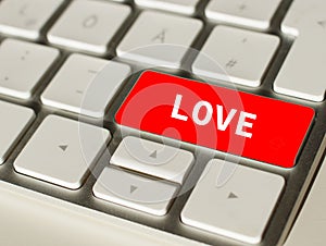Love on Red button of a keyboard