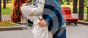 Love, relationship, family and people concept - close up of couple the guy tips the girl and kisses, the man is hugging