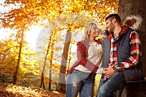 Love, relationship, family and people concept - couple in autumn